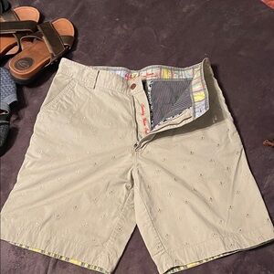Men's Tan Shorts with embroidery design.